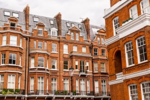 Facade of opulent  British Victorian Edwardian terraced flat in red bricks in Chelsea, London.